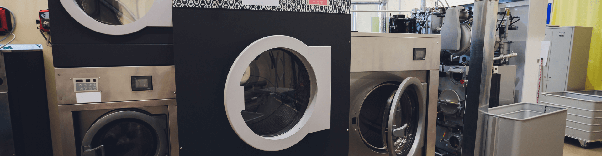 Commercial dry cleaning machines designed for fume extraction and efficient airflow management in tight spaces.