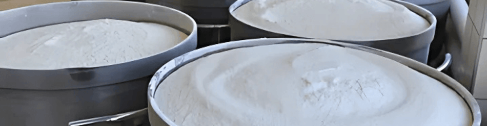 FDA-compliant containers holding dry powder for safe movement in food production, ensuring static safety and compliance.