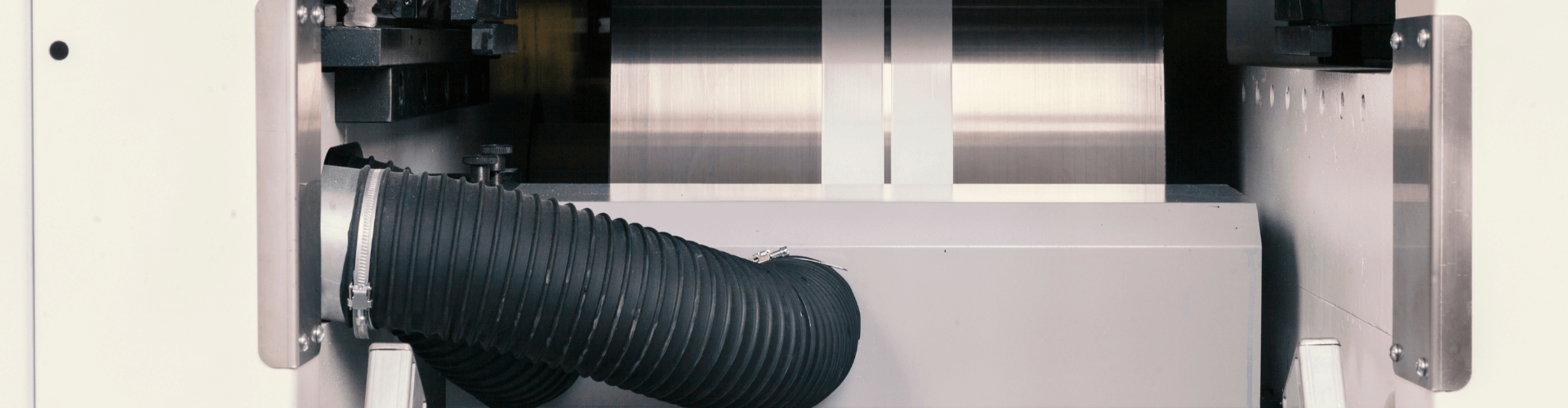Fume extraction system for printing, featuring chemical-resistant hose for effective solvent and ink fume capture.