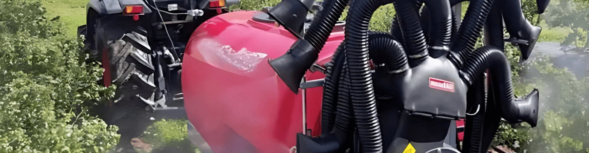 Industrial sprayer attached to a tractor, designed for transferring fluids and chemicals for efficient application.
