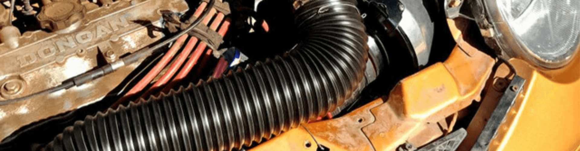 Close-up of transmission cooling duct for performance vehicles, highlighting airflow support and heat stability.