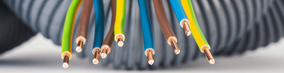 Colorful electrical wires and cables arranged for flexible routing in automated systems and industrial setups.