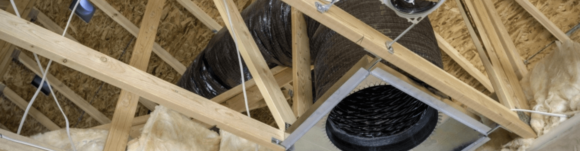 Interior view of a ceiling showing heater ductwork and insulation for efficient warm air transfer.