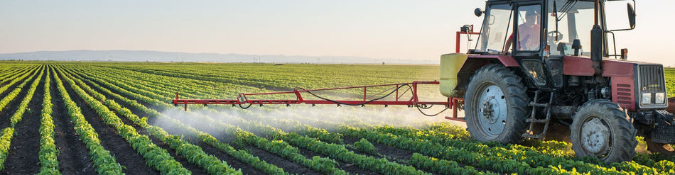 Tractor preparing agricultural land with advanced equipment for effective crop planting and soil management.